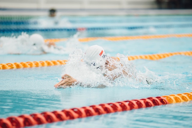 Swimmer in a pool, water splashing