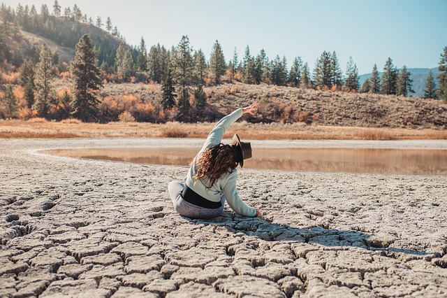 Person practicing yoga at sunset